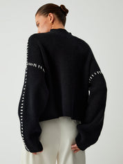 Black ribbed sweater with white dotted trim back view