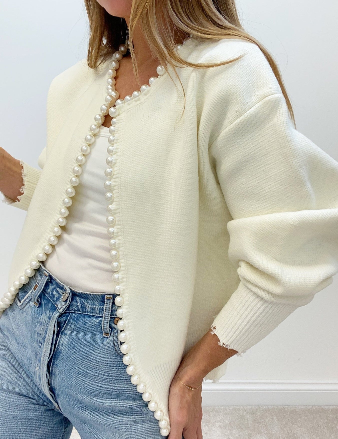 Cream cardigan with pearl embellishments side view