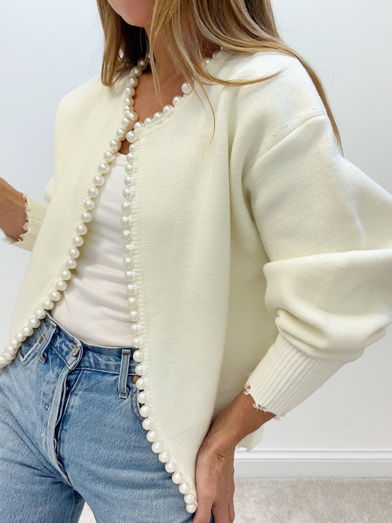 Cream cardigan with pearl embellishments side view
