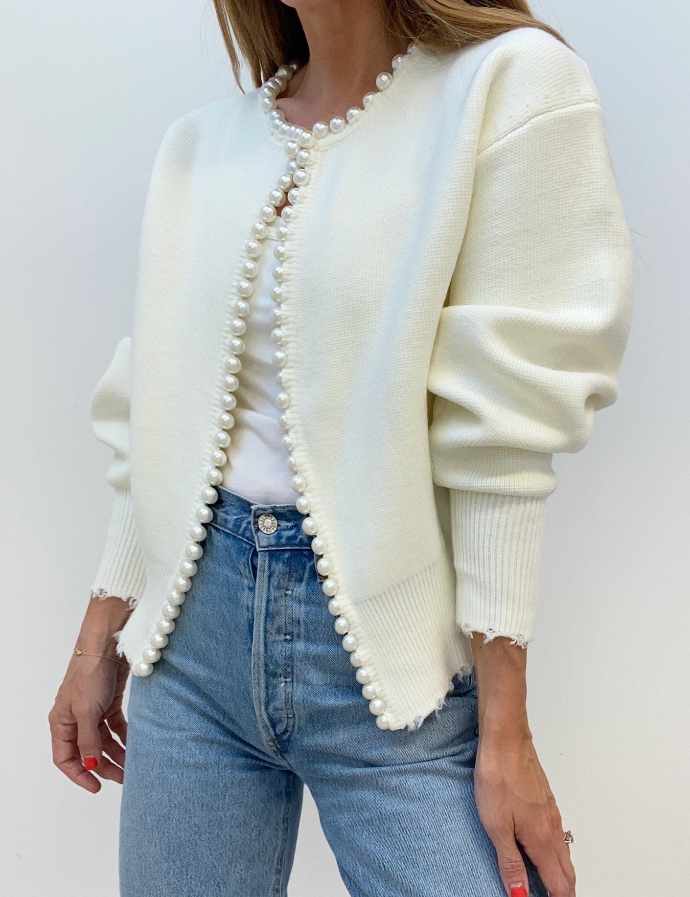 Cream cardigan with pearl embellishments front view
