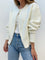 Cream cardigan with pearl embellishments front view