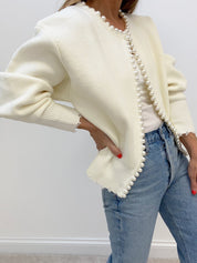 Cream cardigan with pearl embellishments three-quarter view