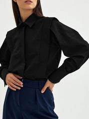 Dames blouse zwart met pofmouwen front view