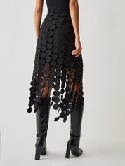 Evening skirt with circular cutouts and fringe detail, back view