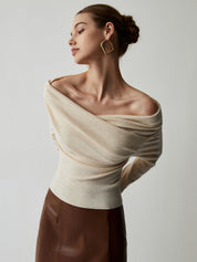 Off-shoulder cream sweater with draped neckline, side view