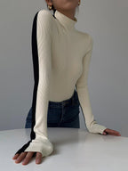 Knitted turtleneck sweater black and white side view