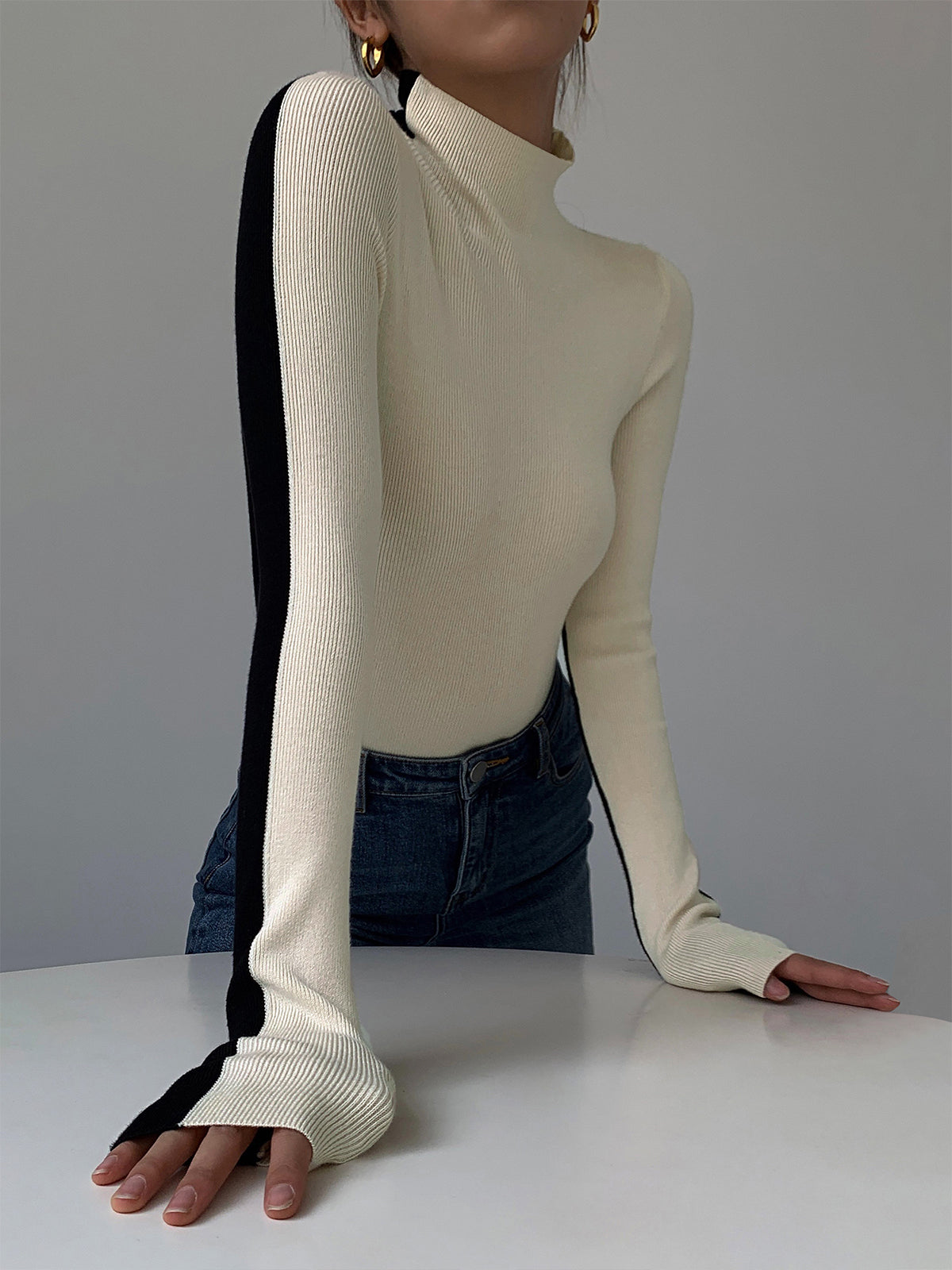 Knitted turtleneck sweater black and white side view