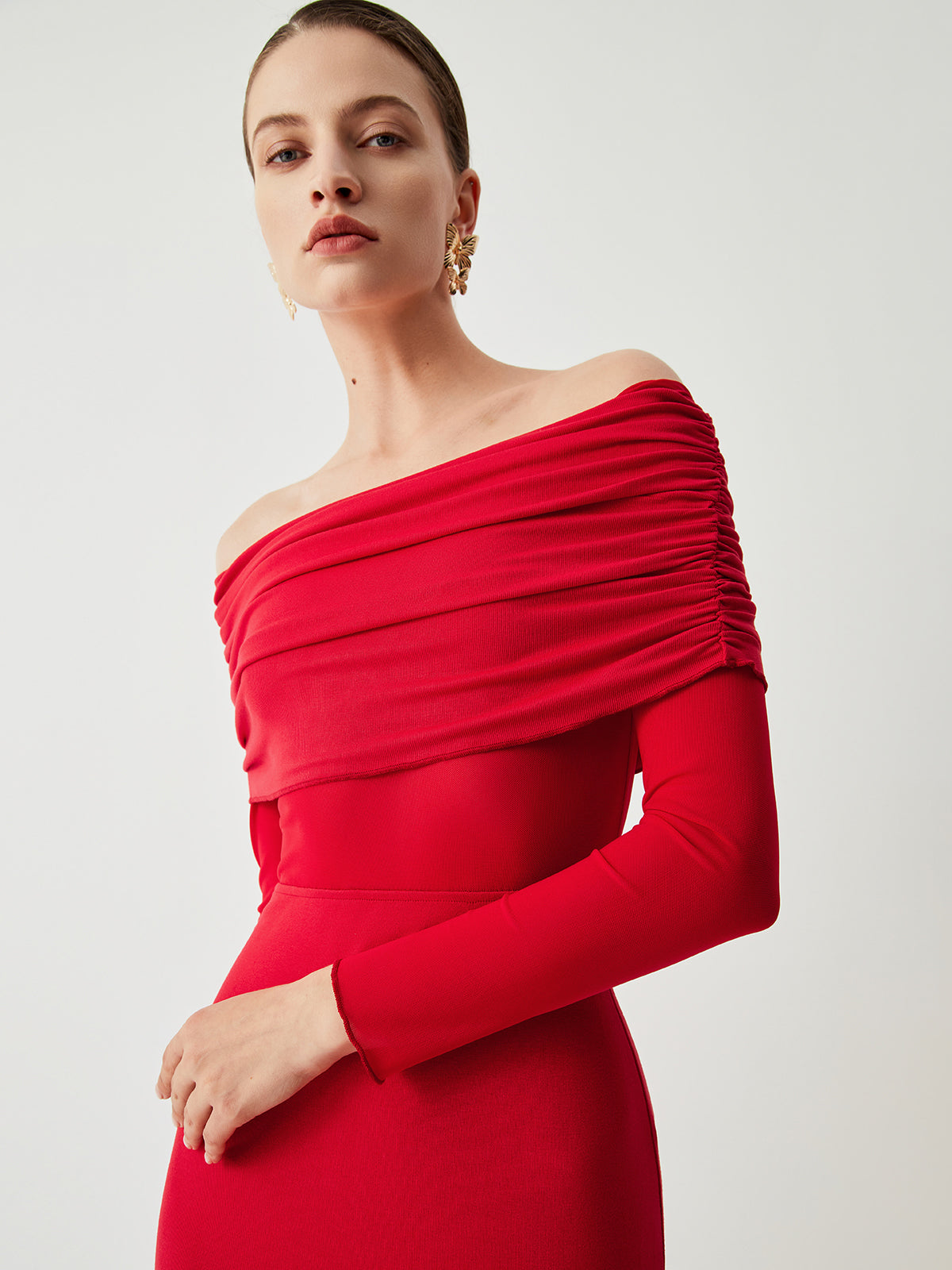 Red off-shoulder dress with ruched bodice close-up detail