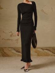 Black asymmetrical neck top with ruched detail side profile