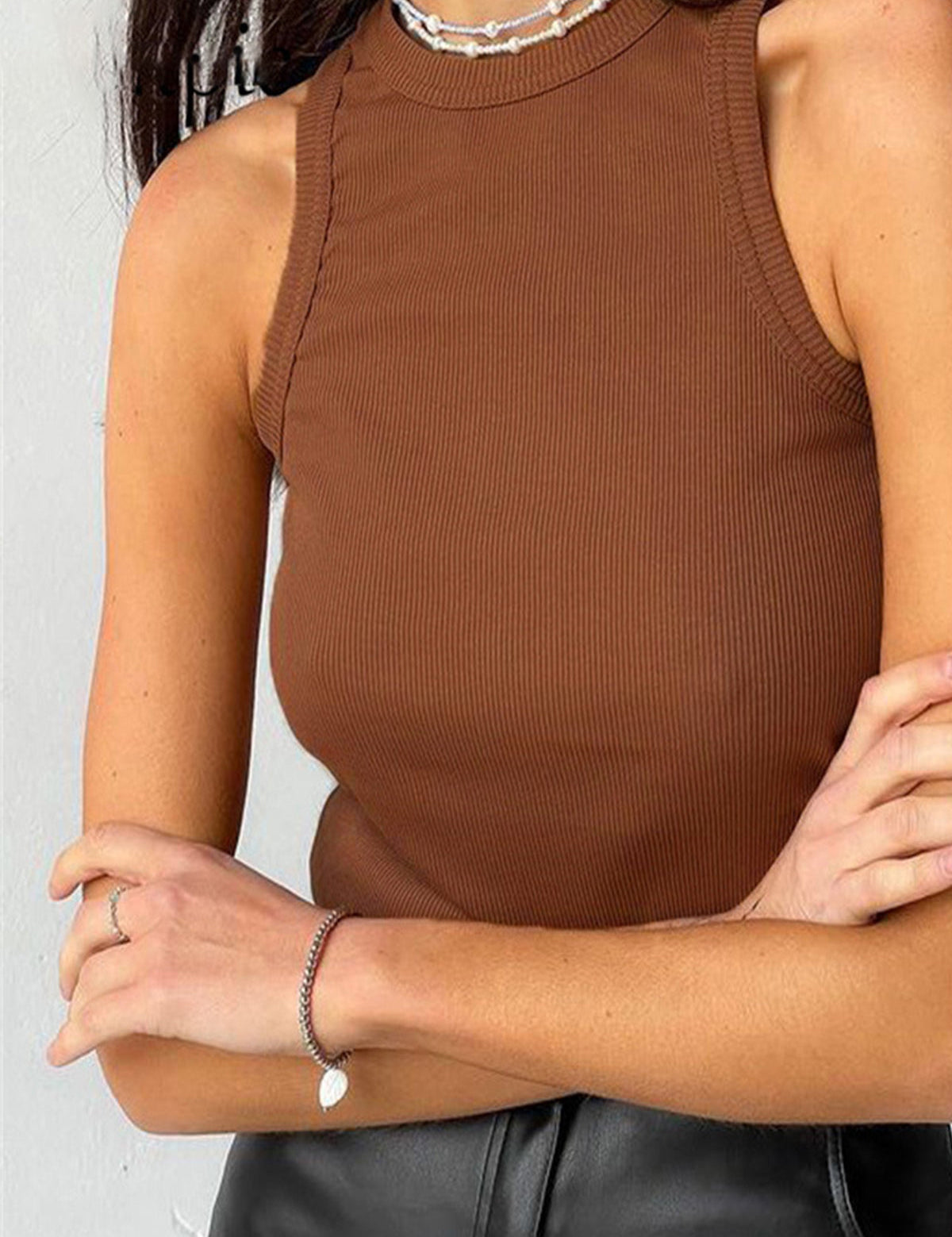Brown ribbed tank top front view with black pants