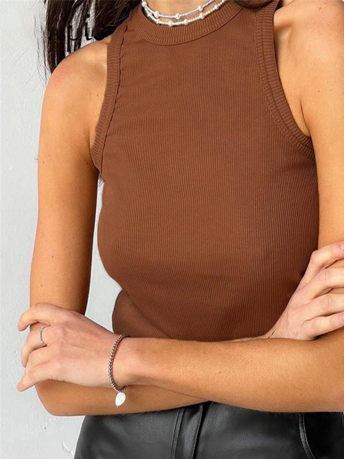 Brown ribbed tank top front view with black pants
