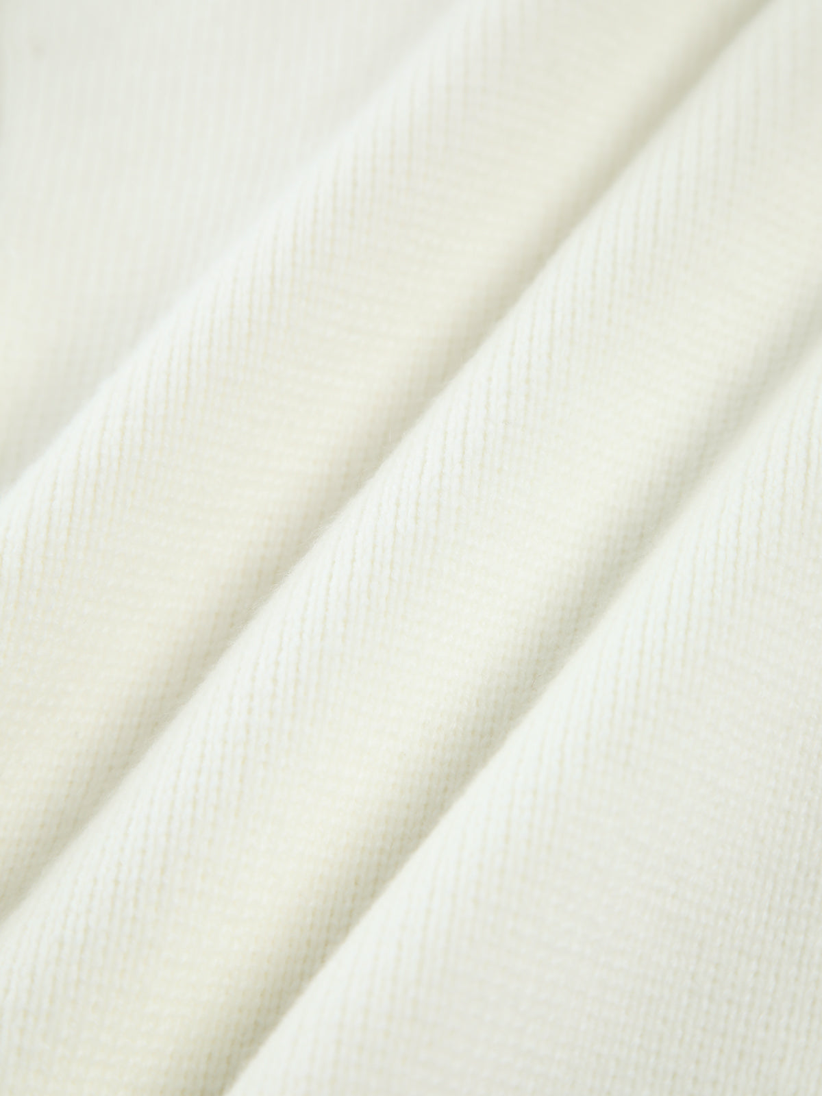 Cream cardigan knit texture close-up
