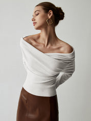 White off-shoulder sweater with draped neckline, side view