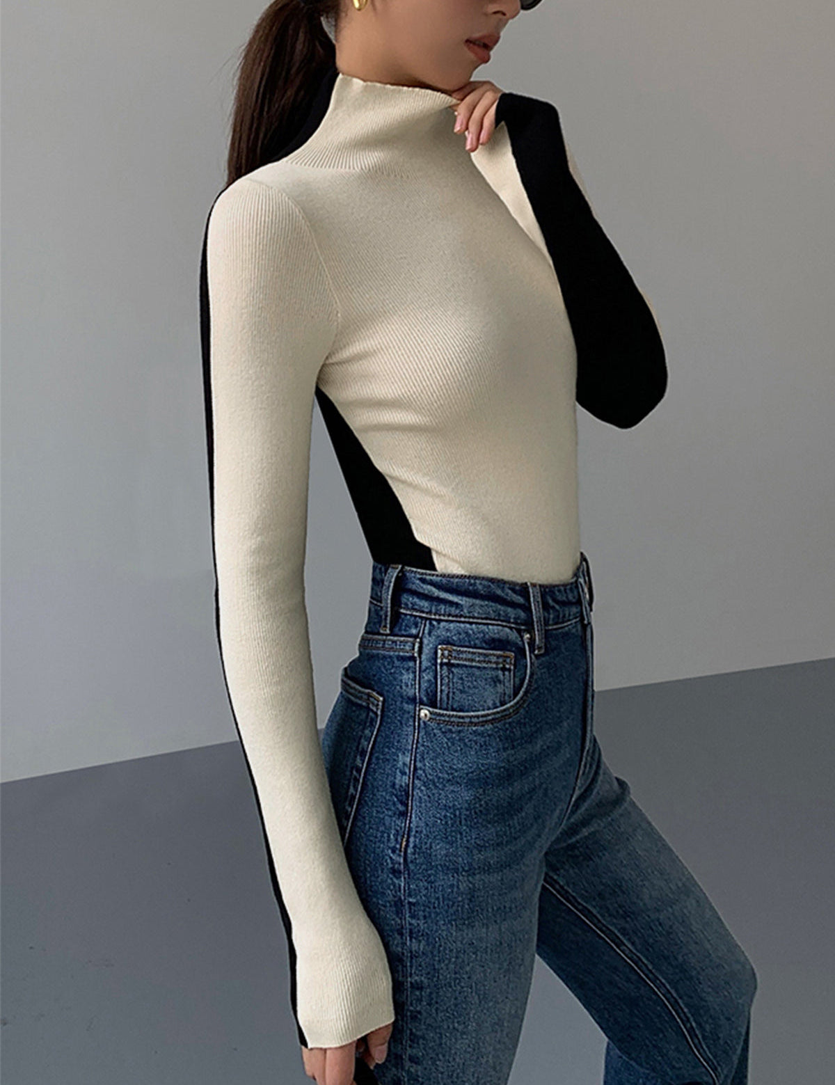Knitted turtleneck sweater black and white side profile