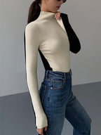 Knitted turtleneck sweater black and white side profile