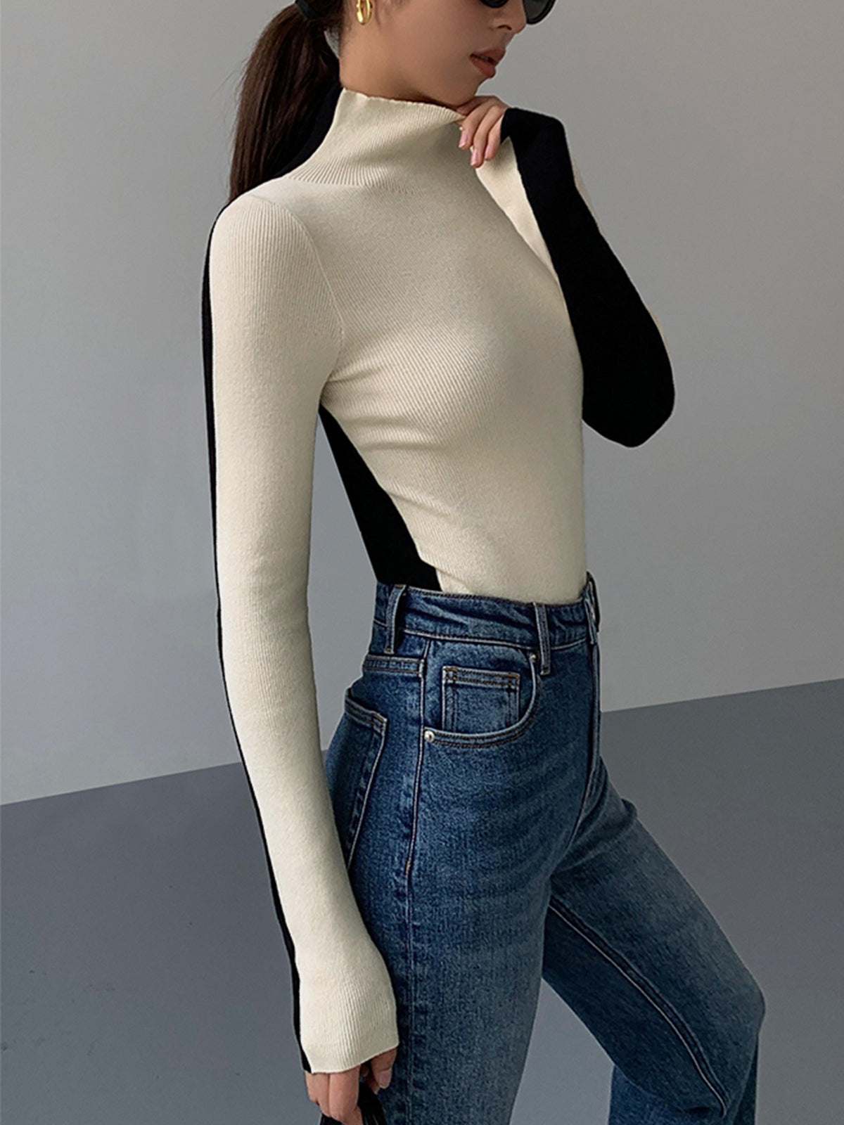 Knitted turtleneck sweater black and white side profile
