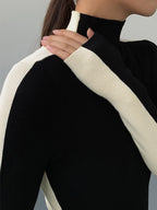 Knitted turtleneck sweater black and white close-up detail