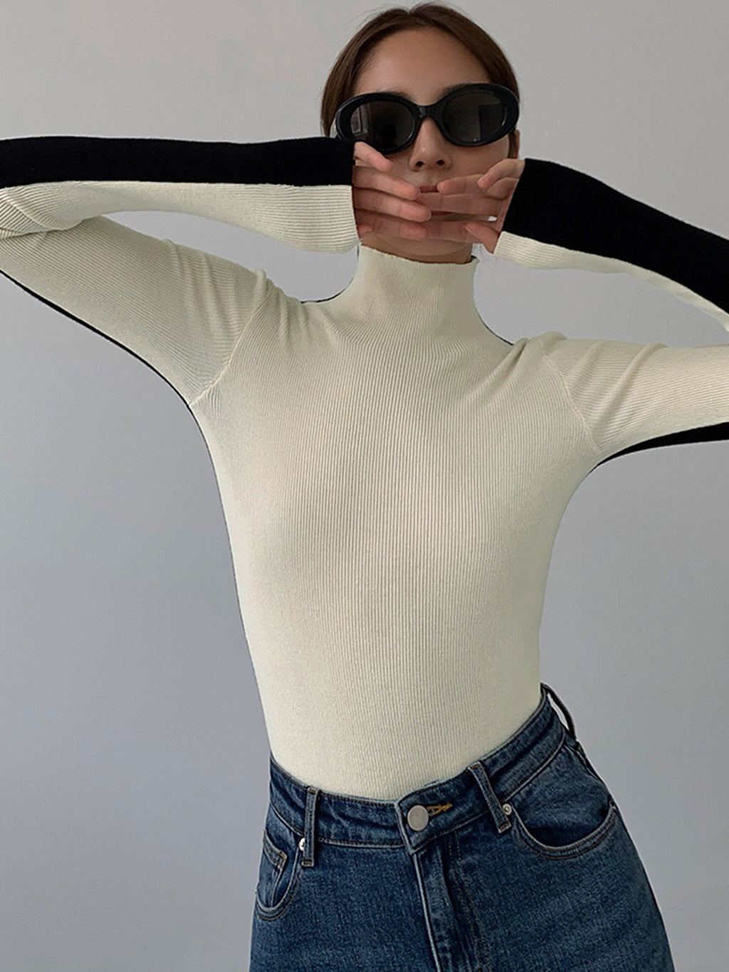 Knitted turtleneck sweater white front view