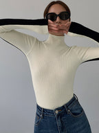 Knitted turtleneck sweater white front view