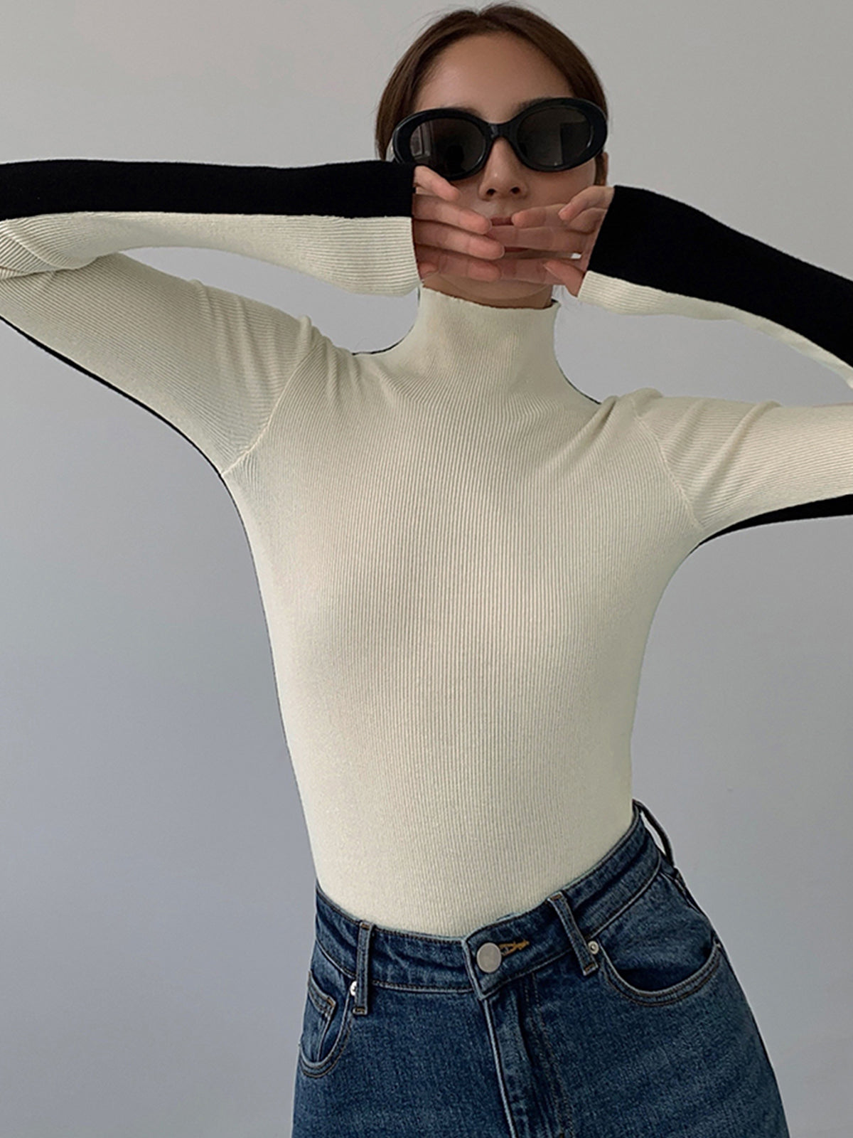 Knitted turtleneck sweater white front view