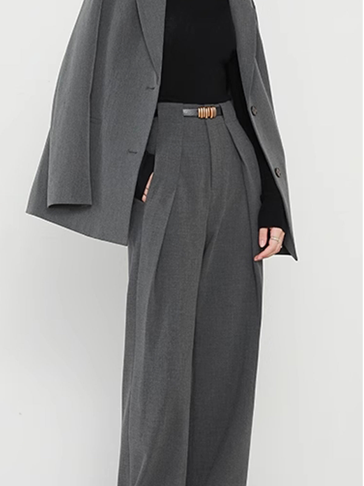 Gray wide-leg trousers with gold belt buckle and blazer detail