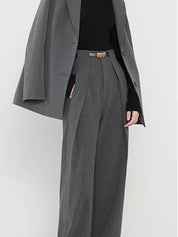 Gray wide-leg trousers with gold belt buckle and blazer detail