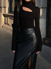 Black asymmetrical neckline bodysuit with leather skirt and chain strap bag front view