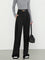 Black wide-leg trousers with gold belt buckle front view