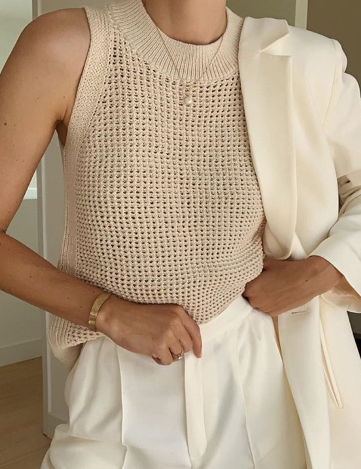 Beige sleeveless top with open texture front view