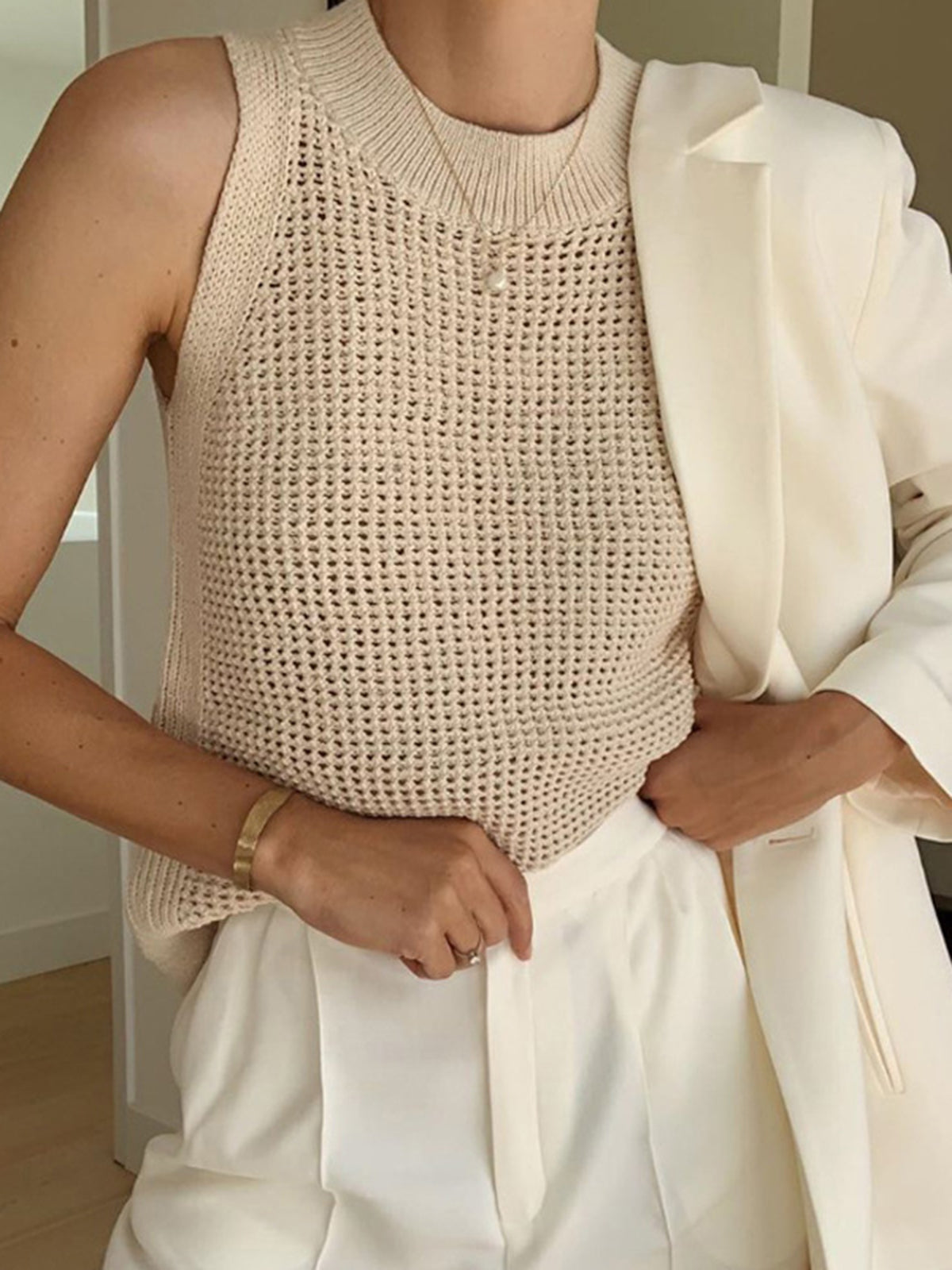 Beige sleeveless top with open texture front view