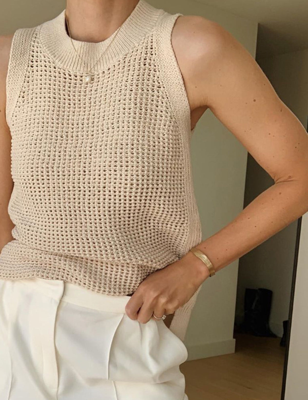 Beige sleeveless top with open texture side view