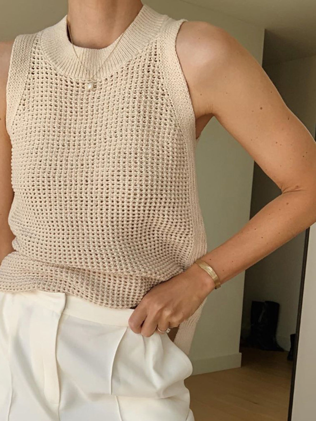 Beige sleeveless top with open texture side view