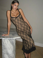 Black lace evening dress with fringe hem side profile