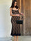 Black lace evening dress with fringe hem front view