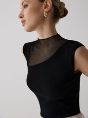 Black ribbed sleeveless top with sheer panel close-up side detail