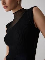 Black ribbed sleeveless top with sheer panel close-up front detail
