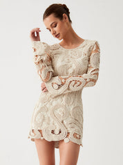 Cream lace dress with intricate patterns front view