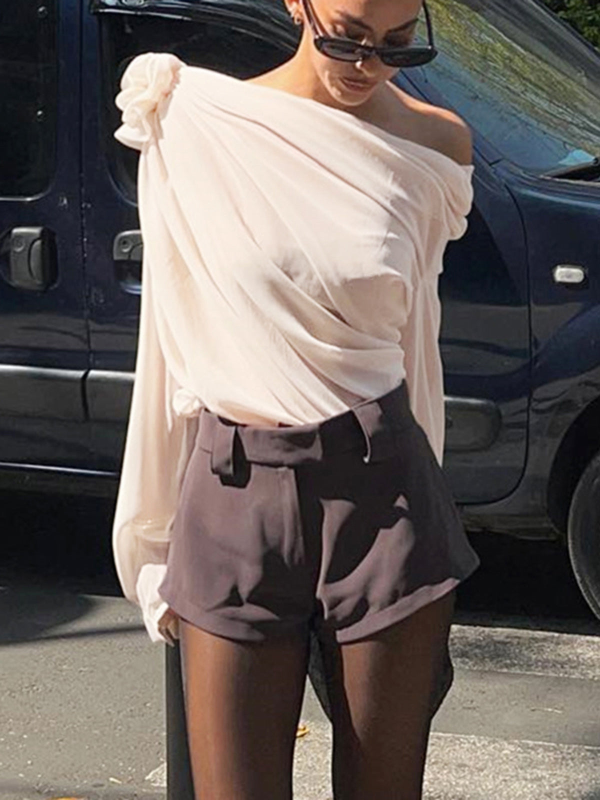 Blouse with draped fabric and floral detail, street view