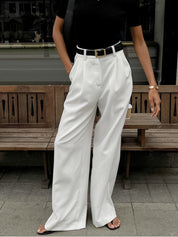 White wide-leg trousers side view with belt