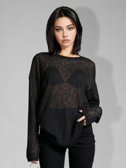 Off-shoulder sheer black sweater side view