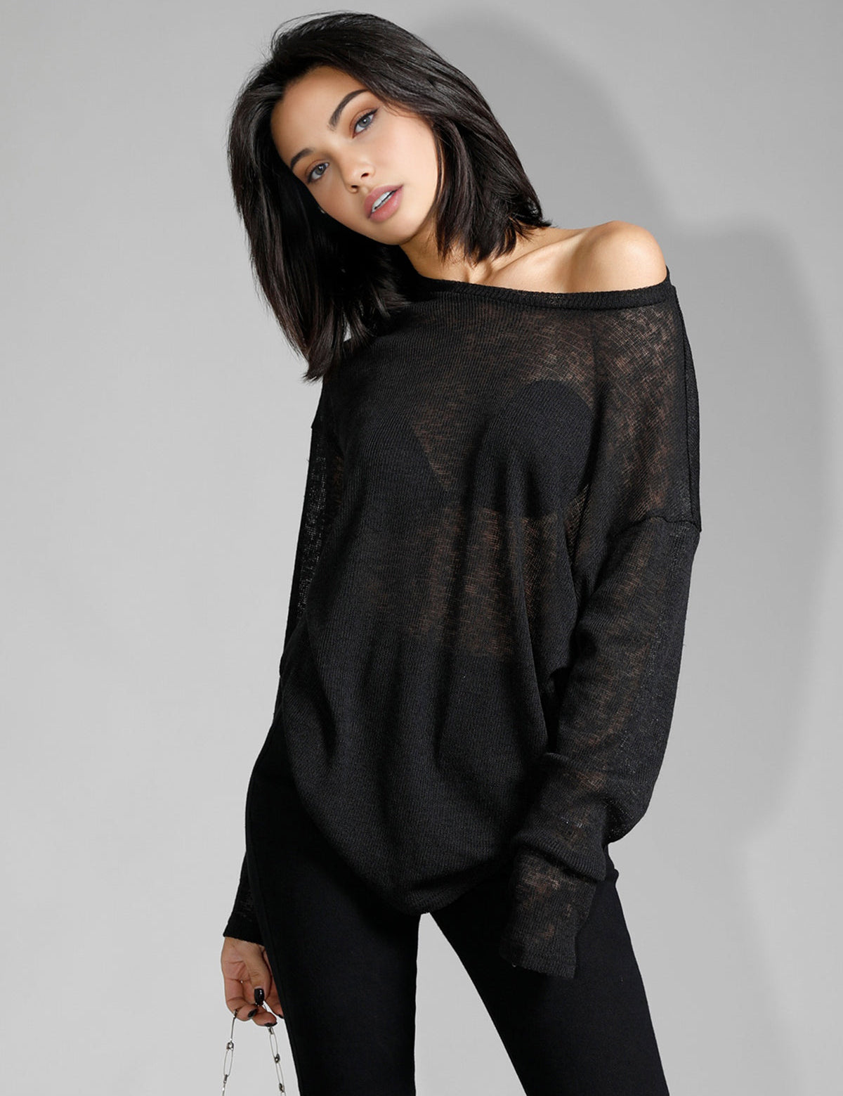 Off-shoulder sheer black sweater front view