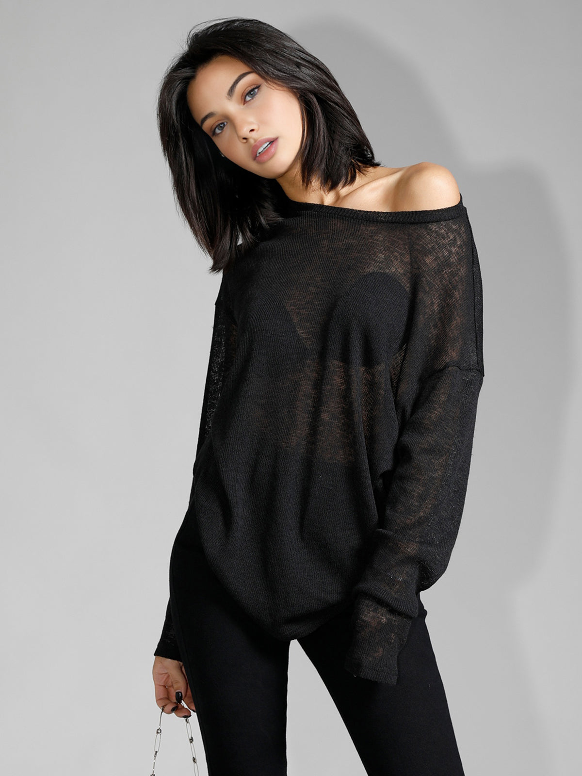 Off-shoulder sheer black sweater front view