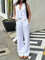 White linen set with wide-leg pants and buttoned top, front view