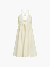 Cream maxi dress front view, crisscross straps and ruched bodice