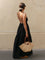 Black maxi dress with open back and thin straps, side view