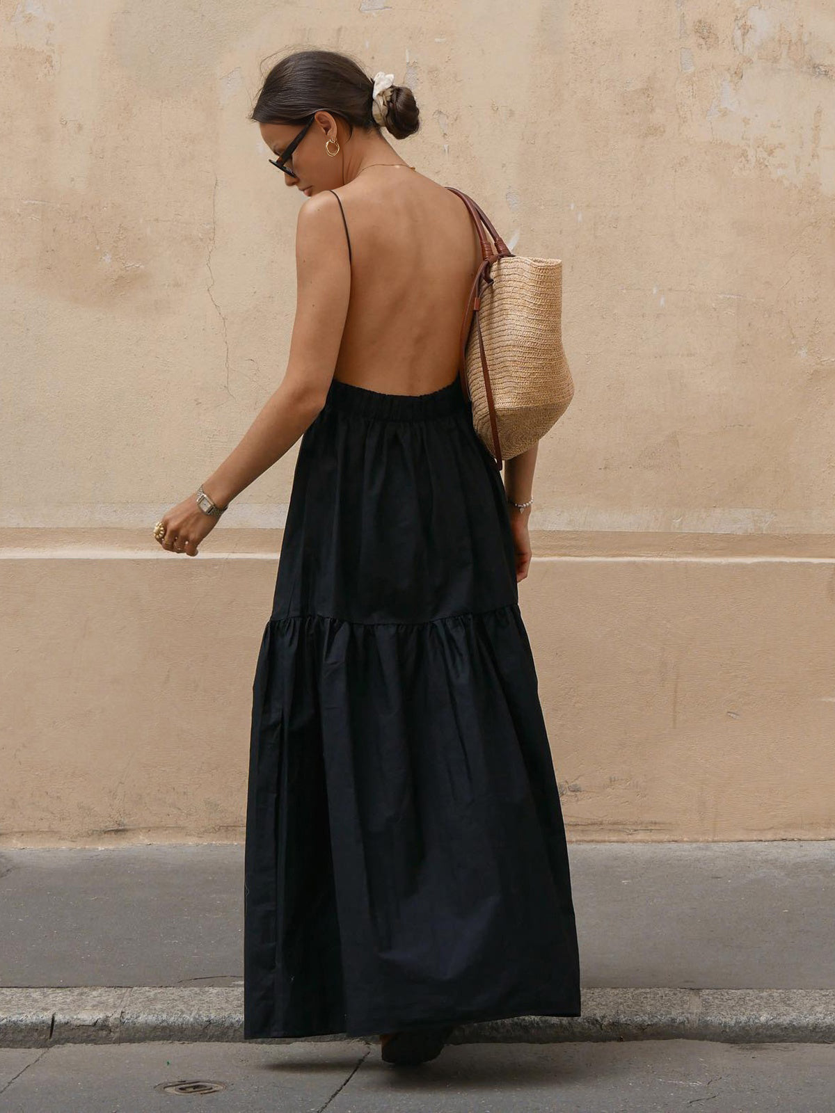 Black maxi dress with open back and thin straps, front view