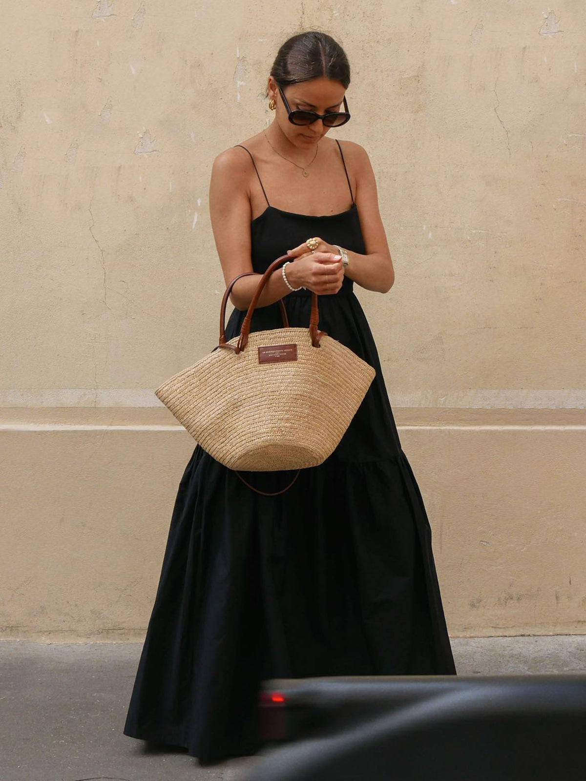 Black maxi dress with thin straps, front view with accessories