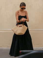 Black maxi dress with thin straps, front view with accessories