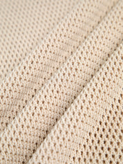 Beige sleeveless top with open texture close-up detail