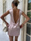 Pink satin dress with open back and bow detail, back view